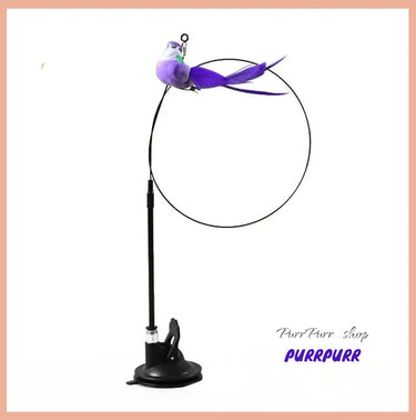 Purple bird-shaped cat teaser toy with soft feathers and jingle bell